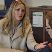 An alumna talking to a student at the 30 Minute Mentors Event